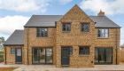 New 4 build stone house for developer - rear aspect
