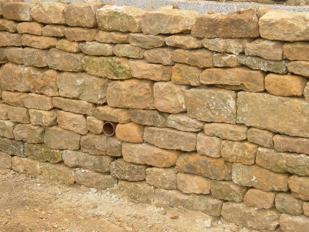  Drystone wall. Backfilled with block supporting wall and drainage